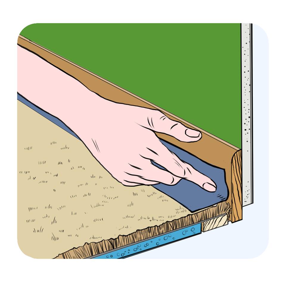 applying masking tape where the carpet meets the skirting board
