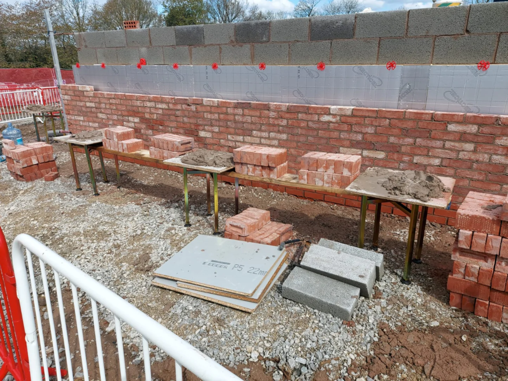 bricks and concrete on top of mortar stand